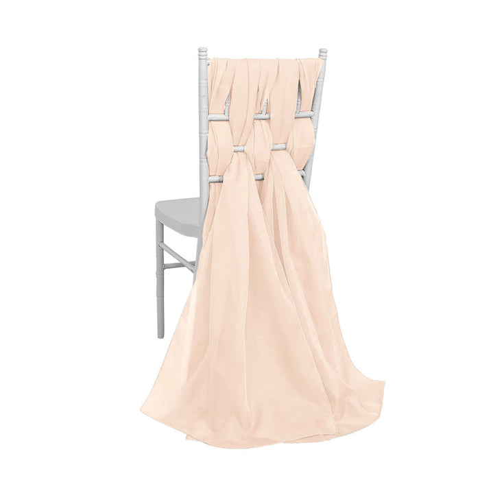 Peach chiffon chair sash draped elegantly over a white chair