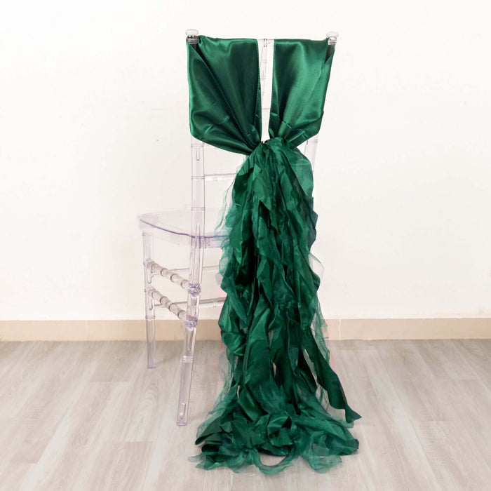 Green satin chair sash with ruffled design draped on a clear chair.
