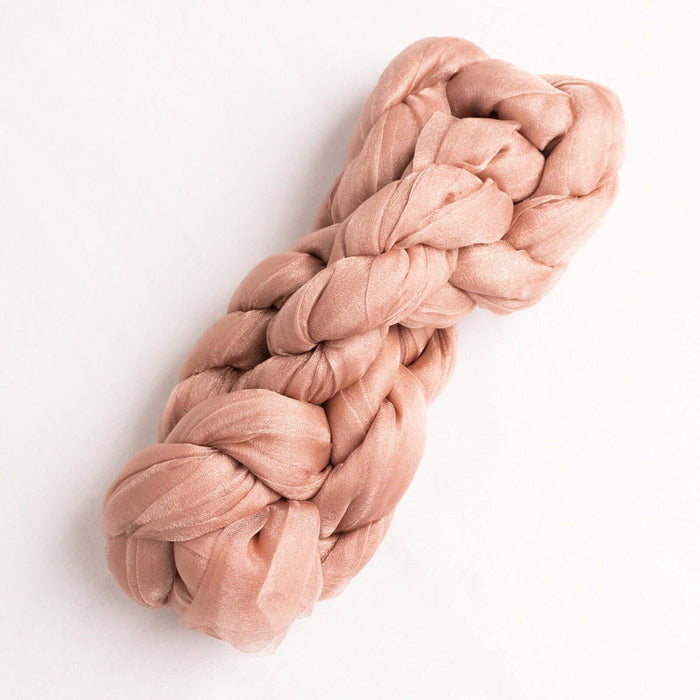 Braided silk ribbon in soft blush color on a plain background #whtbkgd