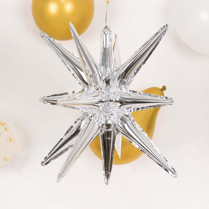 Silver star-shaped balloon decoration for festive events.