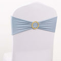 Blue chair sash with gold embellishment on a white backdrop
