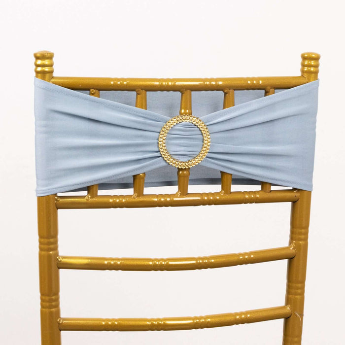 Gold chiavari chair with light blue satin sash and decorative ring detail.