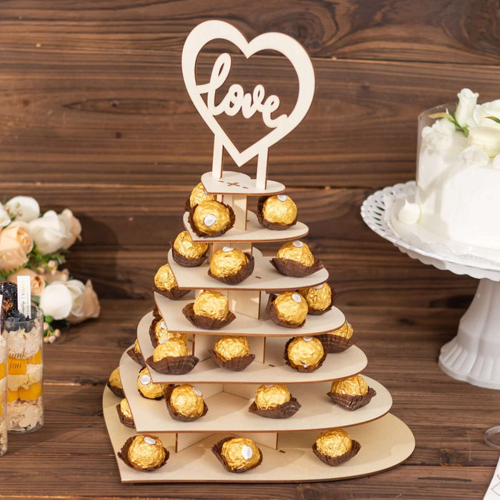 Chocolate Ferrero Rocher tower with heart-shaped "love" topper.