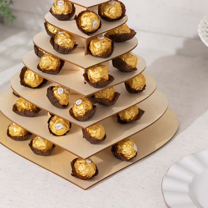 Ferrero Rocher chocolate tower display on a beige stand