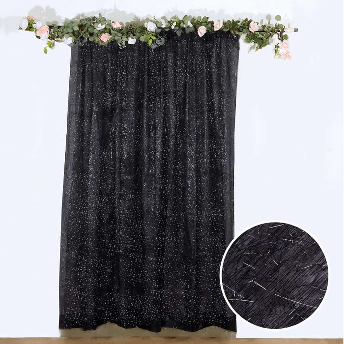 Black sheer curtain with star pattern, featuring close-up texture detail.