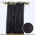 Black sheer curtain with star pattern, featuring close-up texture detail.