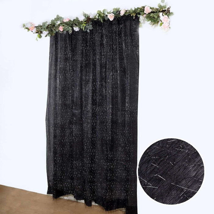 Black sheer curtain with floral accents and sparkly texture detail.
