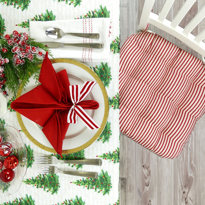 peppermint candy cane striped chair cushions at christmas dining table with matching cloth napkins