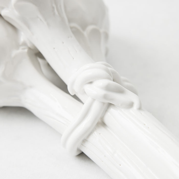 Handmade white glazed ceramic artichoke stems tied together with a decorative ceramic knot detail.