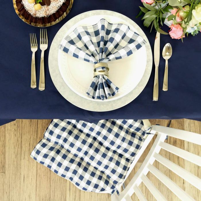 table setting with blue checkered napkins and chair cushion