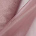 Pink satin fabric draped elegantly, showcasing its smooth texture and sheen.