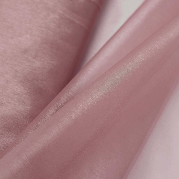 Pink satin fabric draped elegantly, showcasing its smooth texture and sheen.