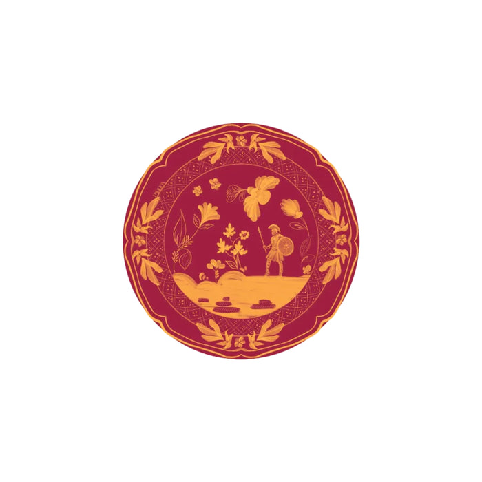 Decorative plate with gold warrior and floral design on a red background
