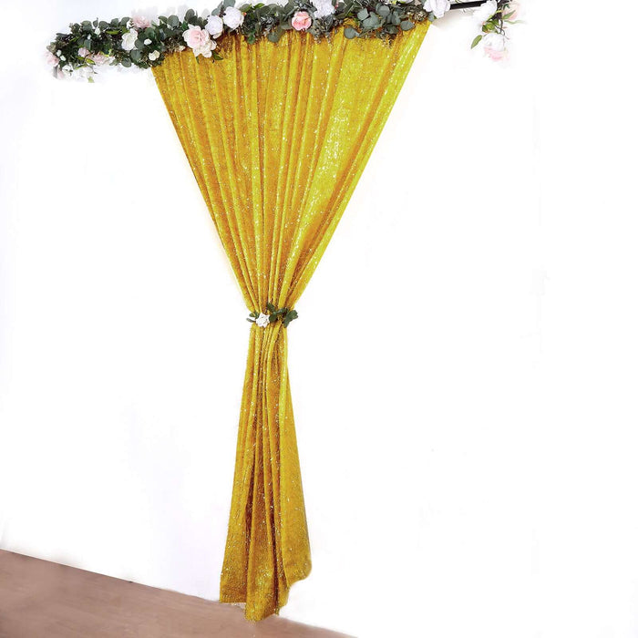 Shimmering gold curtain draped elegantly with floral accents