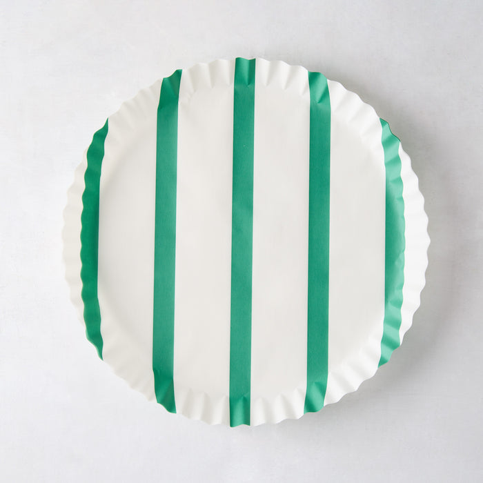 White round parchment liner with green vertical stripes and ruffled edges.