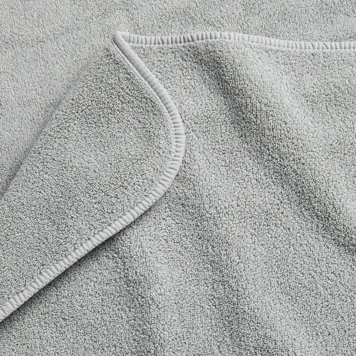 Mist blue Signature bath towel with a soft, plush terry texture and finished hem detail.