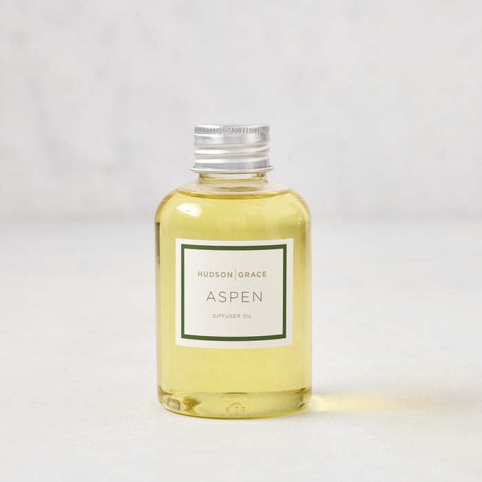 Hudson Grace Aspen Diffuser Oil, 4 fl oz clear glass bottle with silver cap and green label.