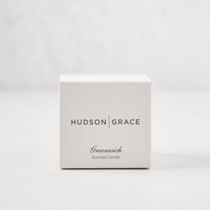 Hudson Grace Greenwich Scented Votive candle in a white gift box with brown text.