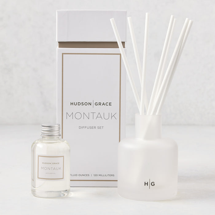 Hudson Grace Montauk diffuser set with white box, frosted glass vessel, reeds, and oil refill bottle.