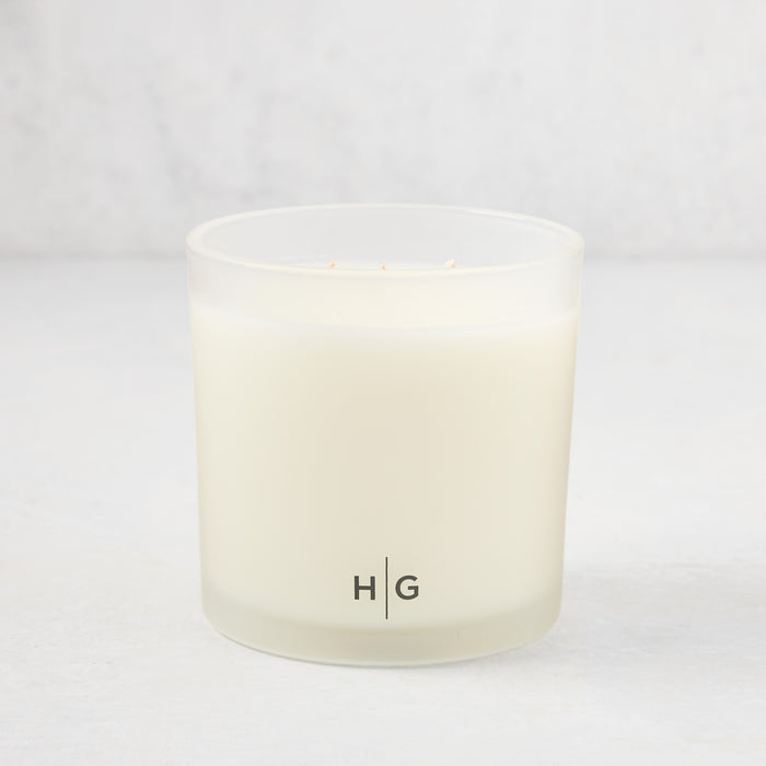 Hudson Grace Montecito 3-wick candle in a frosted glass vessel with HG logo.