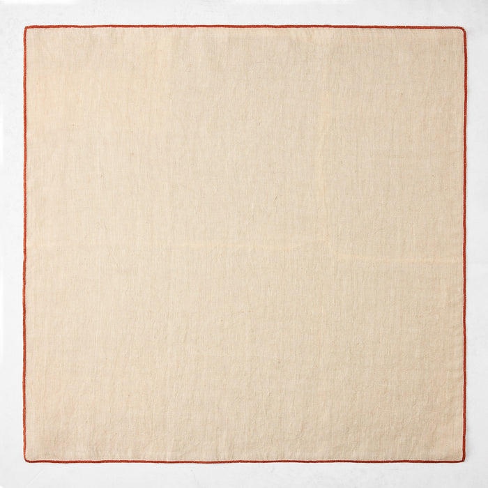 22-inch square khaki linen napkin with a contrasting brick red embroidered stitched edge.