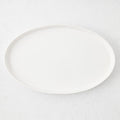 Large white oval stoneware serving platter with a minimalist design, handmade in Portugal.