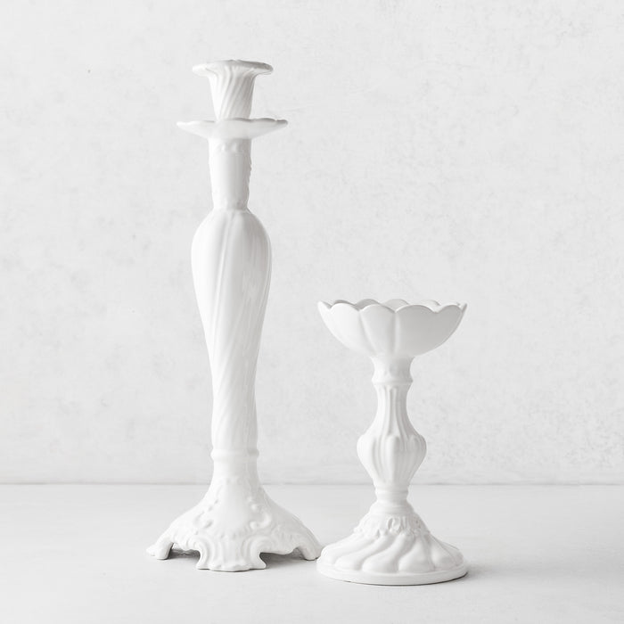 Large and small Tosca white ceramic candlesticks with elegant Italian-inspired vintage detailing.