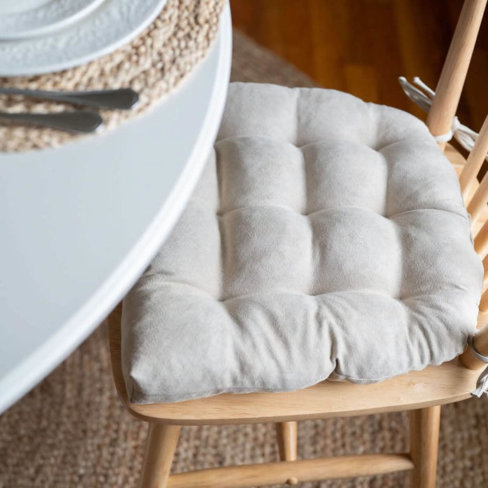 closeup detail view of vegan suede dining room chair cushion