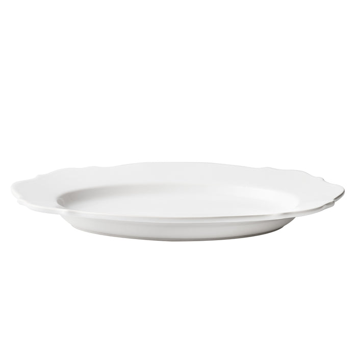 Large white ceramic Lungarno serve platter with softened edges and a smooth glossy glaze, 16.3-inch oval design.