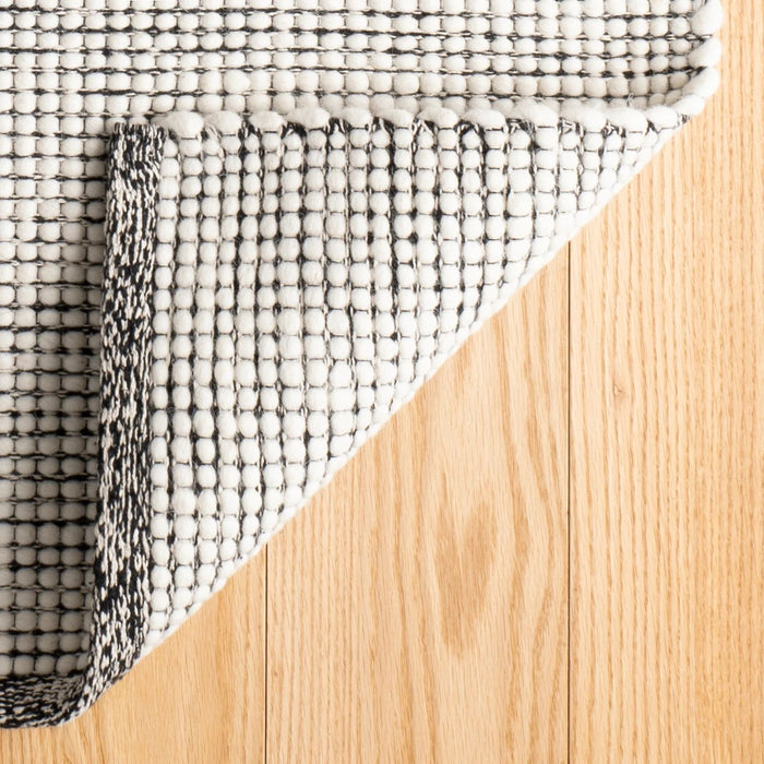 Network Black Handwoven Wool Rug Rug By Annie Selke
