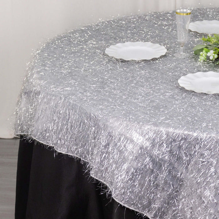 Silver table overlay with textured finish on a round table.