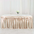 Elegant champagne table skirt with draped design for events and weddings.