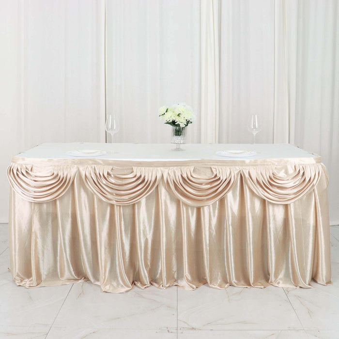 Elegant champagne table skirt with draped design for events and weddings.