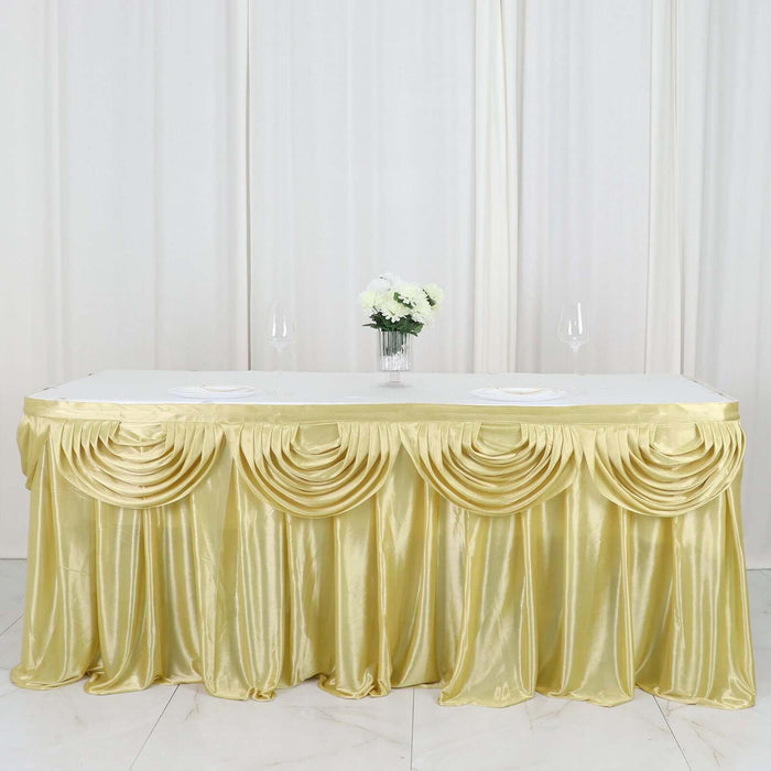 Gold table skirt draped elegantly over a table with floral centerpiece.