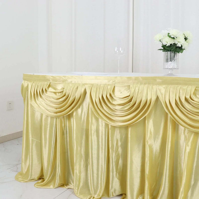 Elegant gold table skirt with pleated design for event decor.