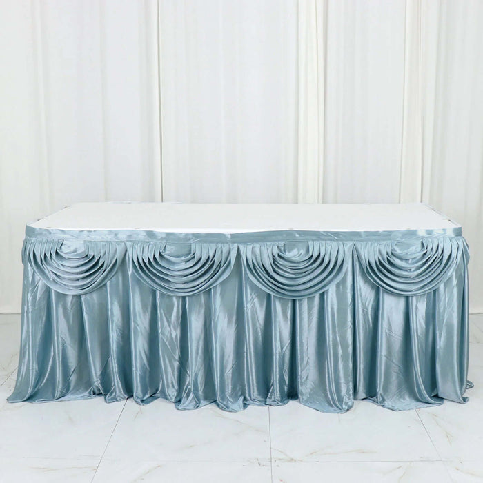 Silver satin table skirt with pleated design, ideal for event decor.