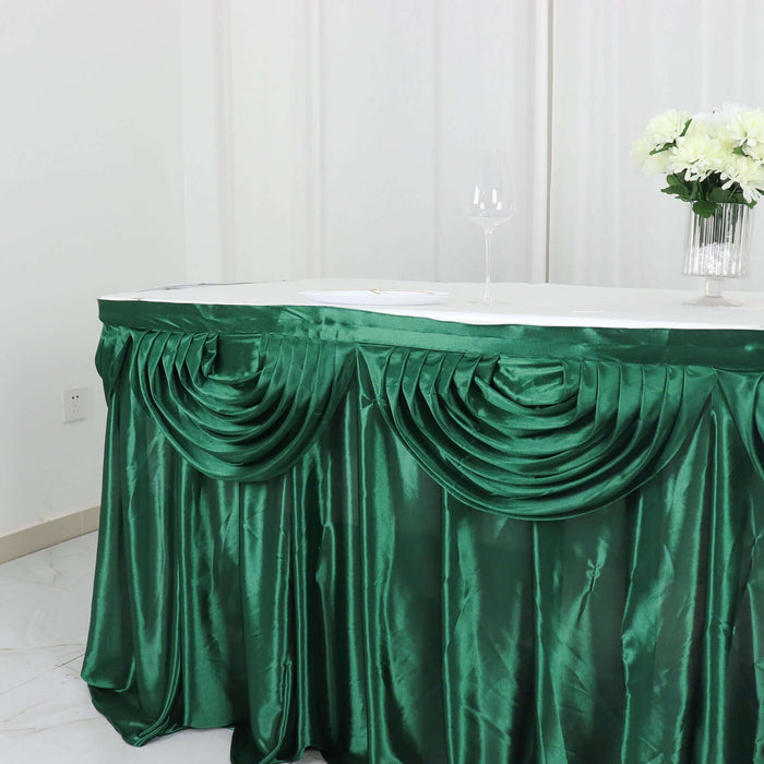 Green table skirt with pleated design for elegant event decor.