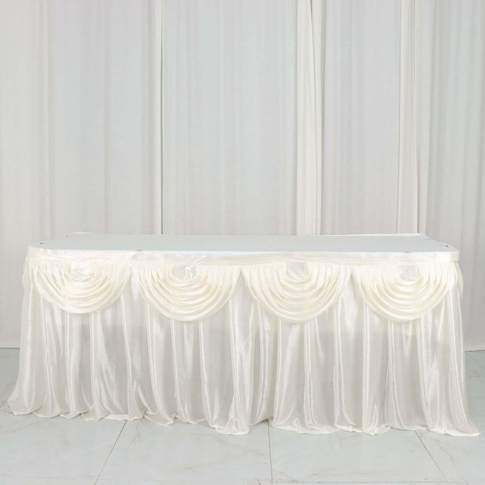 White satin table skirt with elegant draping and pleats.