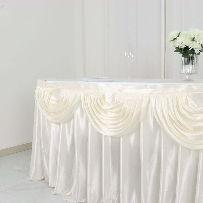 Elegant cream table skirt with draped design for events and celebrations.