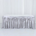 Silver satin tablecloth with elegant draping design.