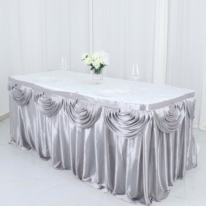Elegant silver tablecloth with draped design, perfect for events and celebrations.