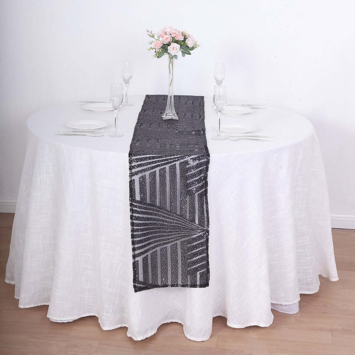 Elegant black table runner on a white dining table setting with floral centerpiece.