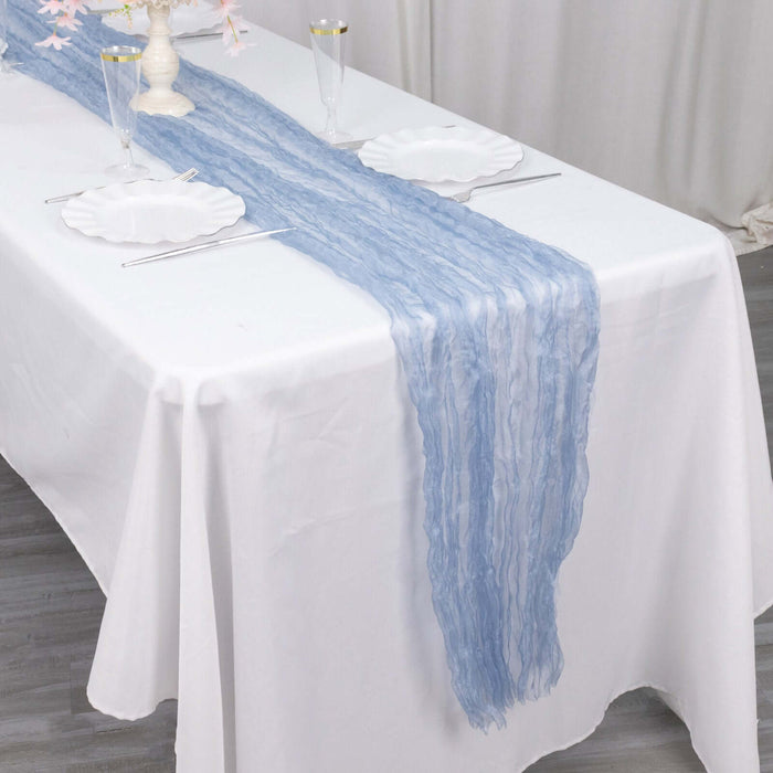 Light blue textured table runner on a white table setting.