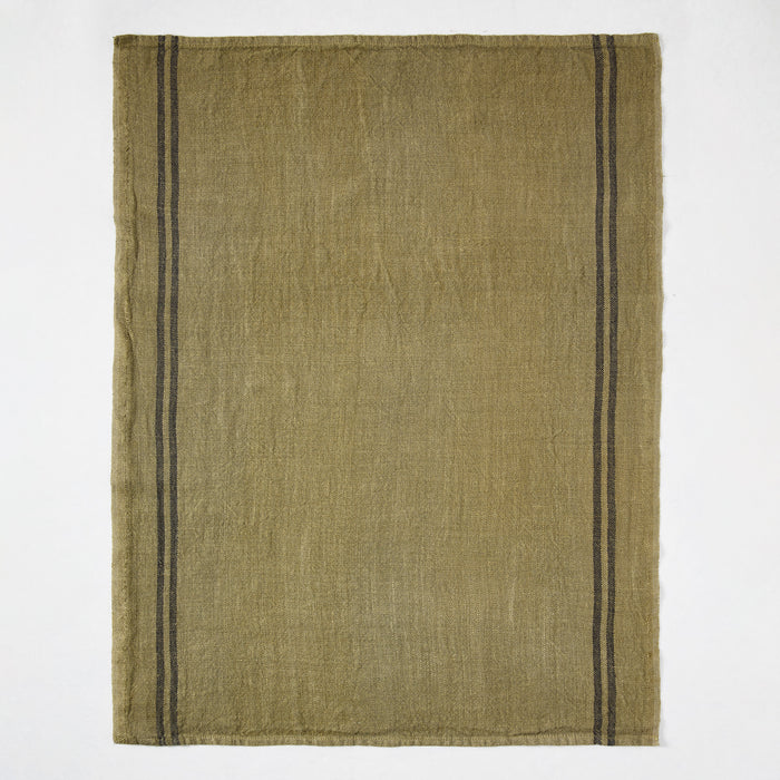 Deep green French linen hand towel with two black stripes along the left edge.
