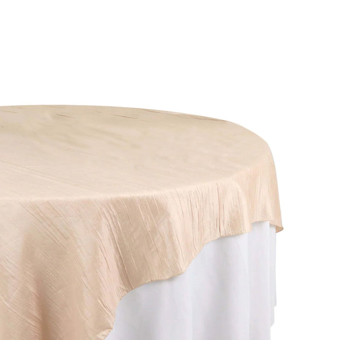 Beige round tablecloth on a white table